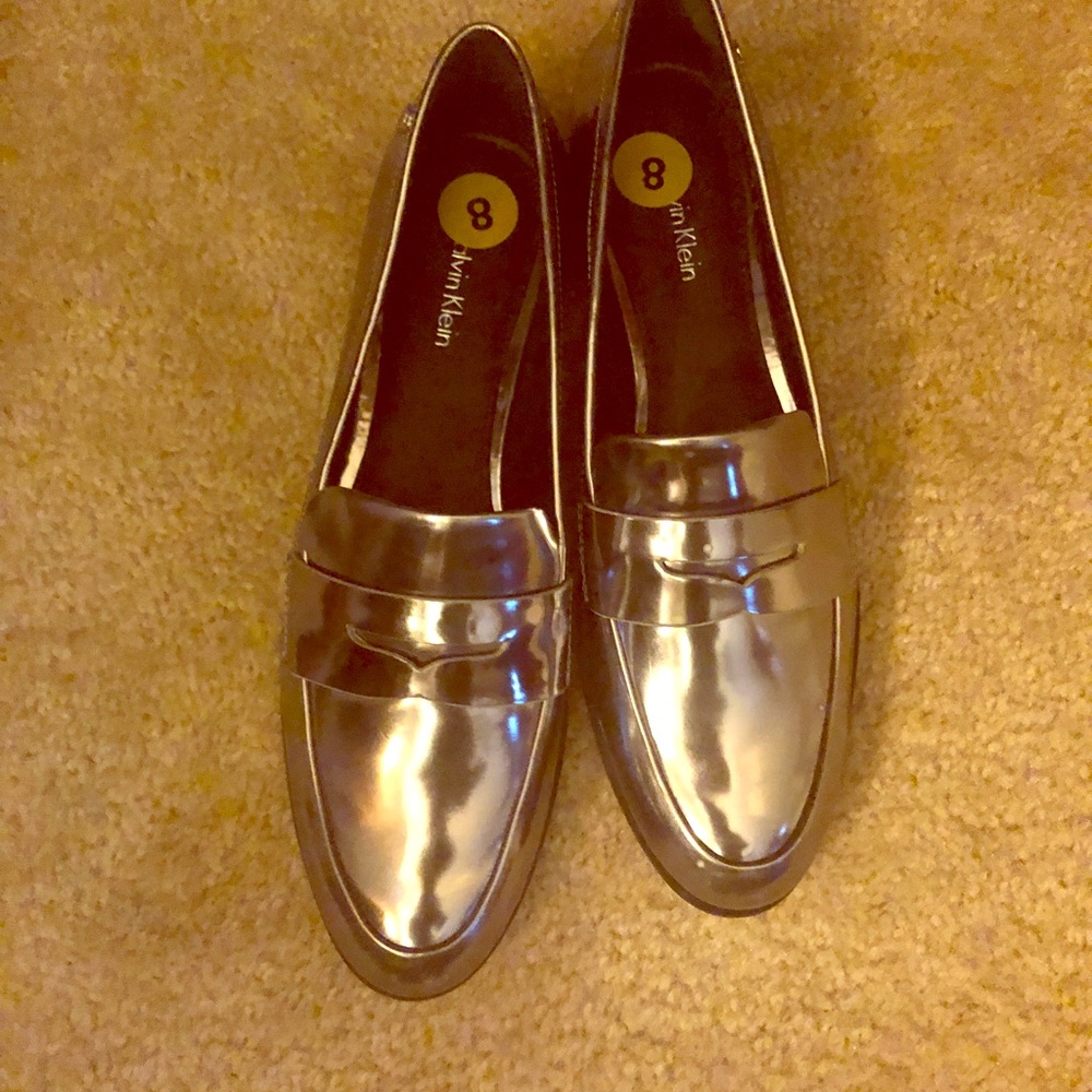 Calvin Klein “Celia” metallic silver loafers